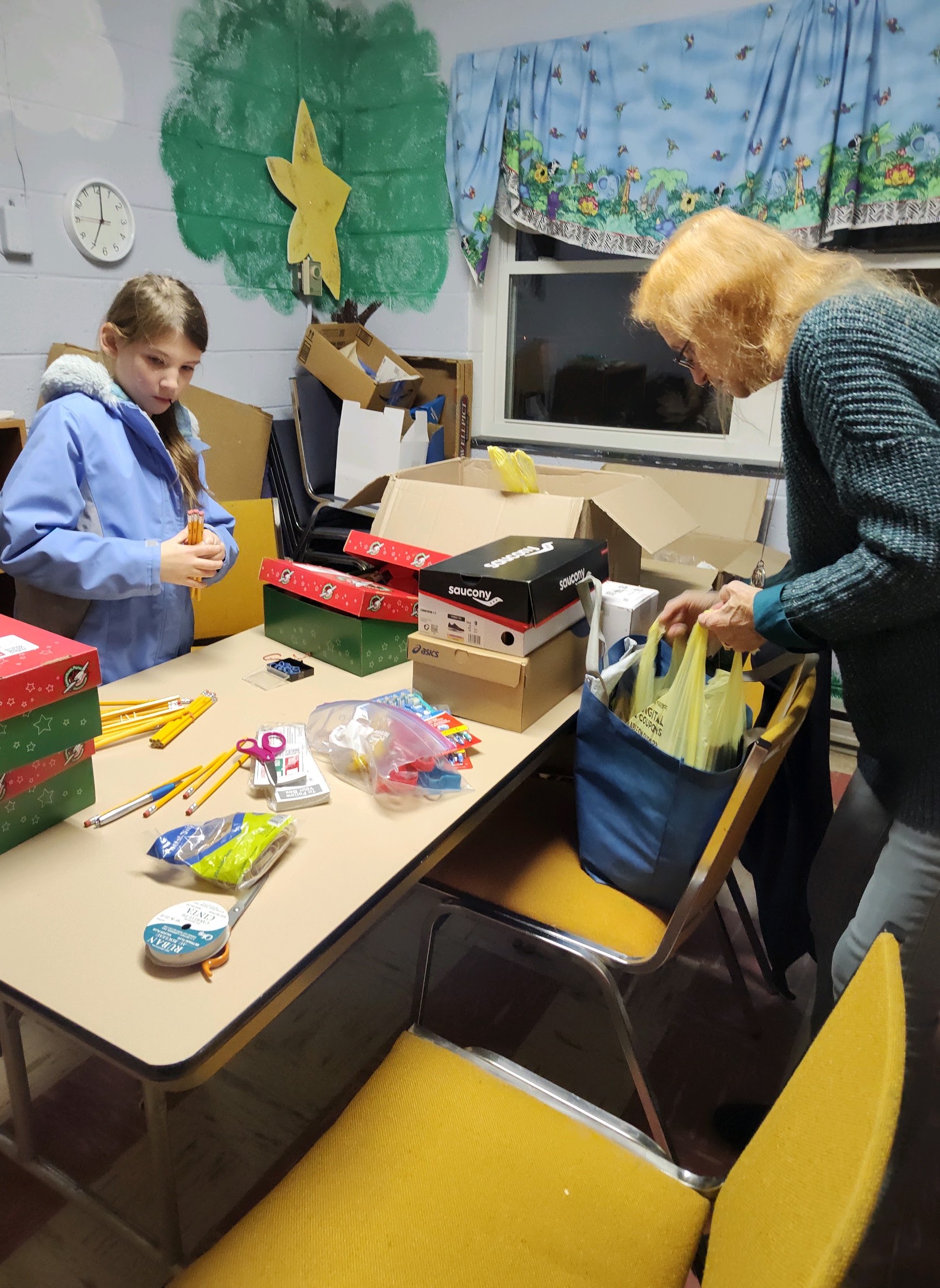 Volunteers packing gifts for children in need